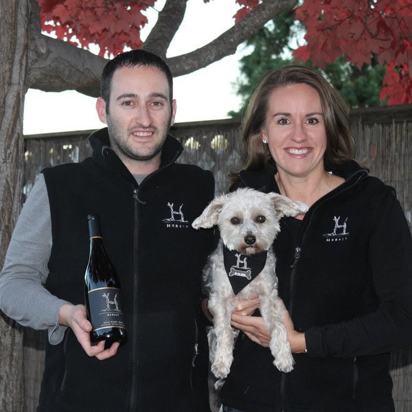 Adam, Stacy and Mae Hersly standing in front of a tree in Hersly logo clothing